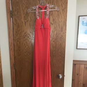 Coral colored prom dress.
